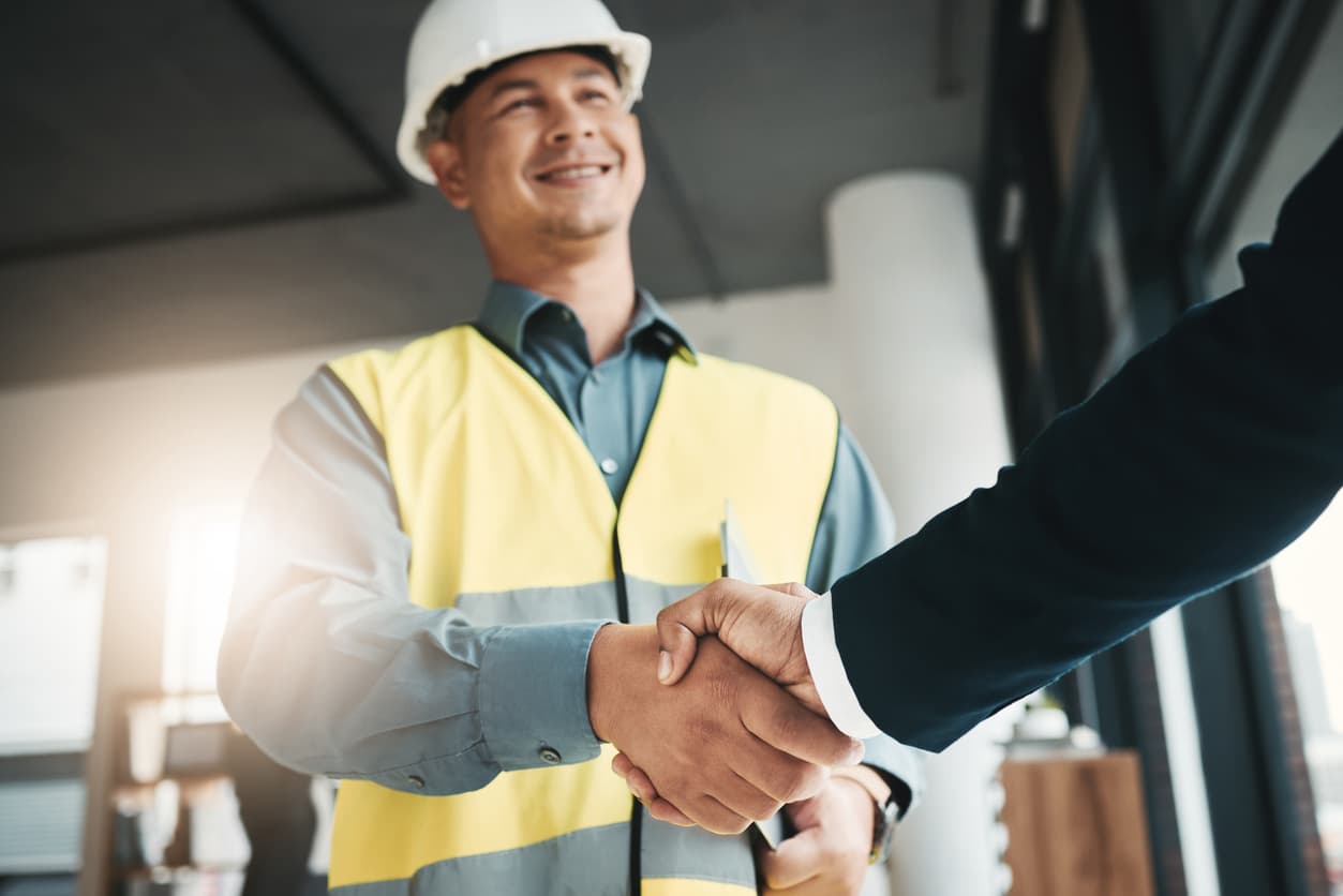 Worker shaking hands with business partner